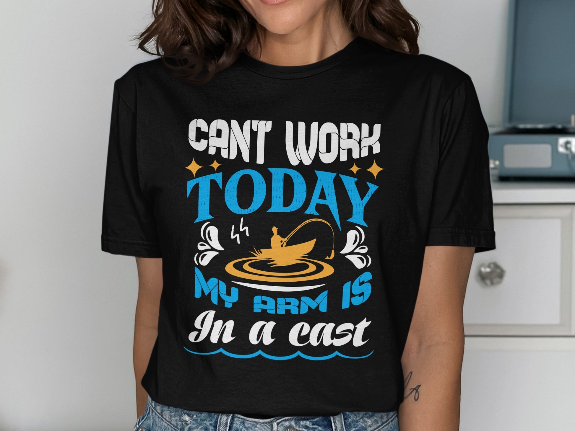 T-shirt with "Can't work today, my arm is in a cast" fishing graphic.