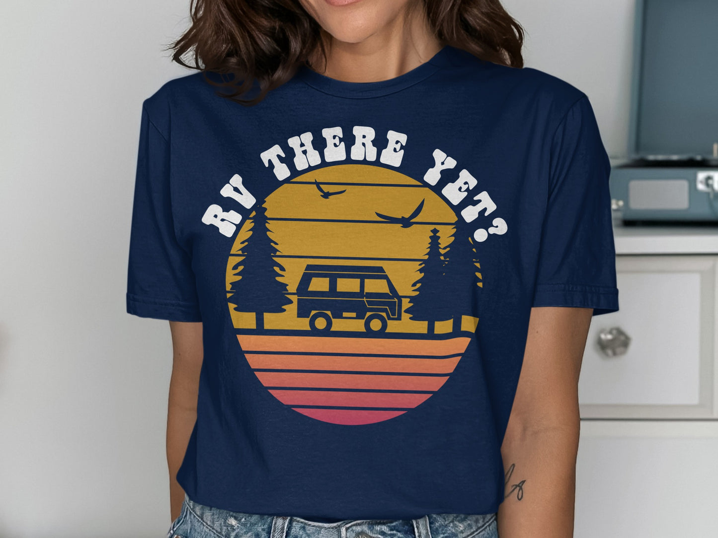 T-shirt with a sunset graphic and text "RV THERE YET?".