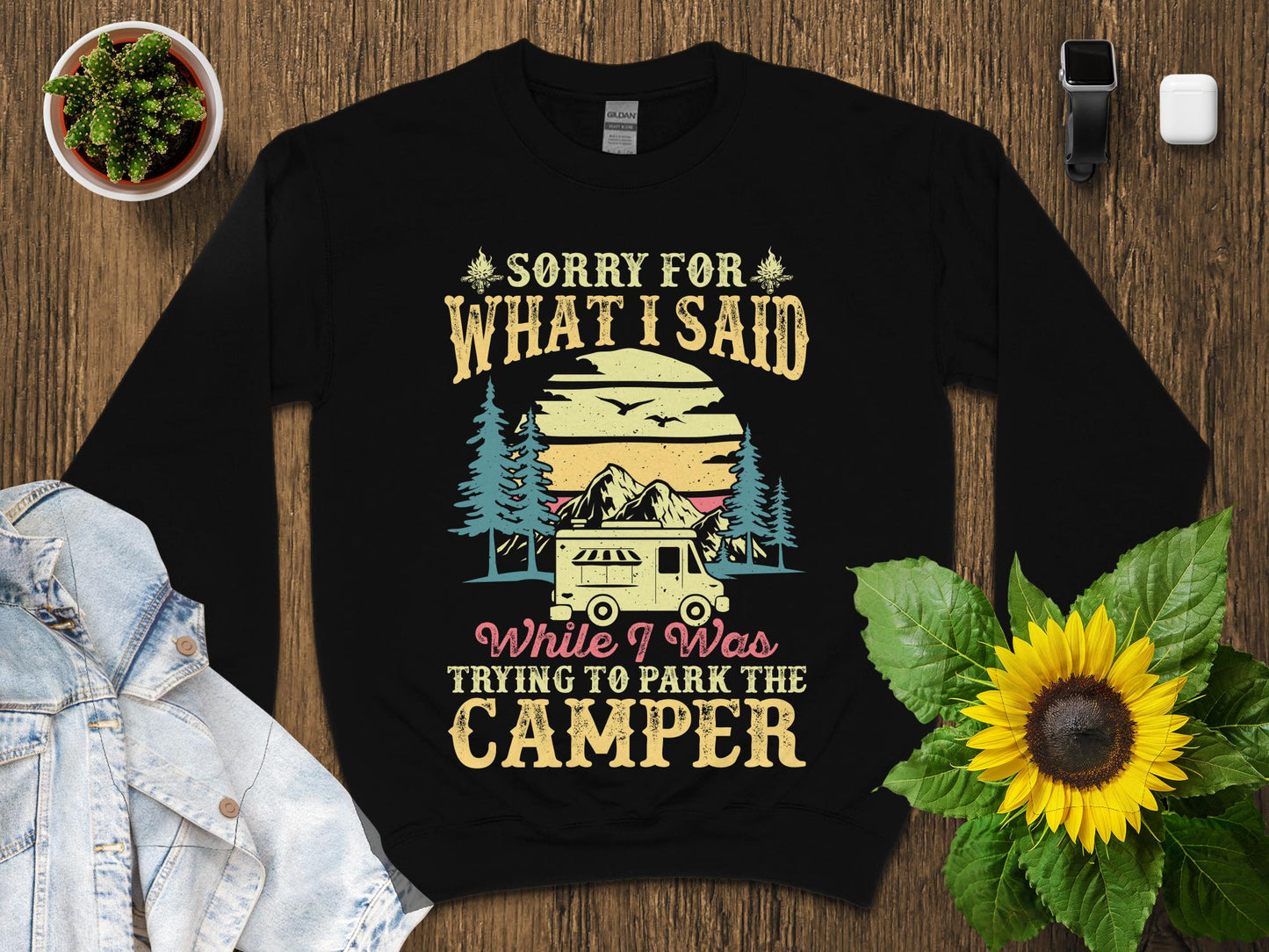 Black sweatshirt with "Sorry for what I said while trying to park the camper" text and graphic.