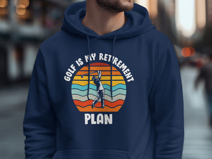 Navy hoodie with "Golf is my retirement plan" text and golfer graphic.