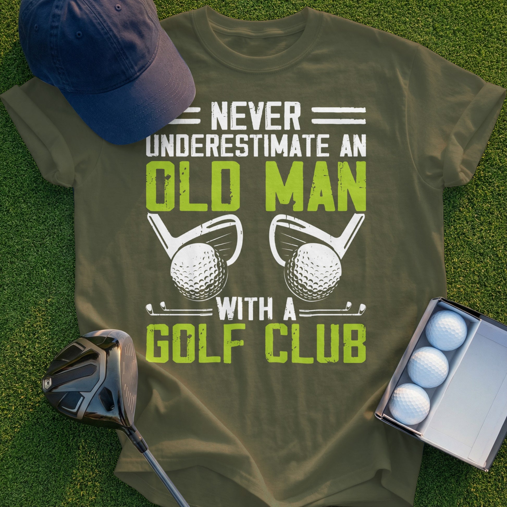 Olive green t-shirt with "Never Underestimate an Old Man With a Golf Club" graphic.