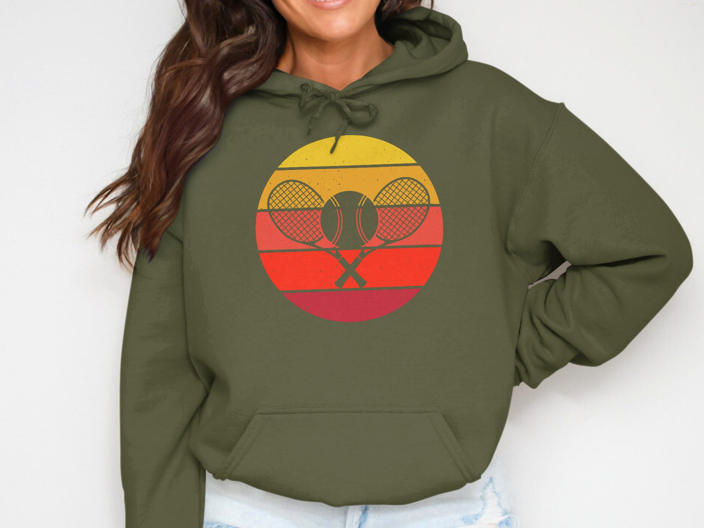 Green hoodie with a circular tennis racket and ball sunset graphic.