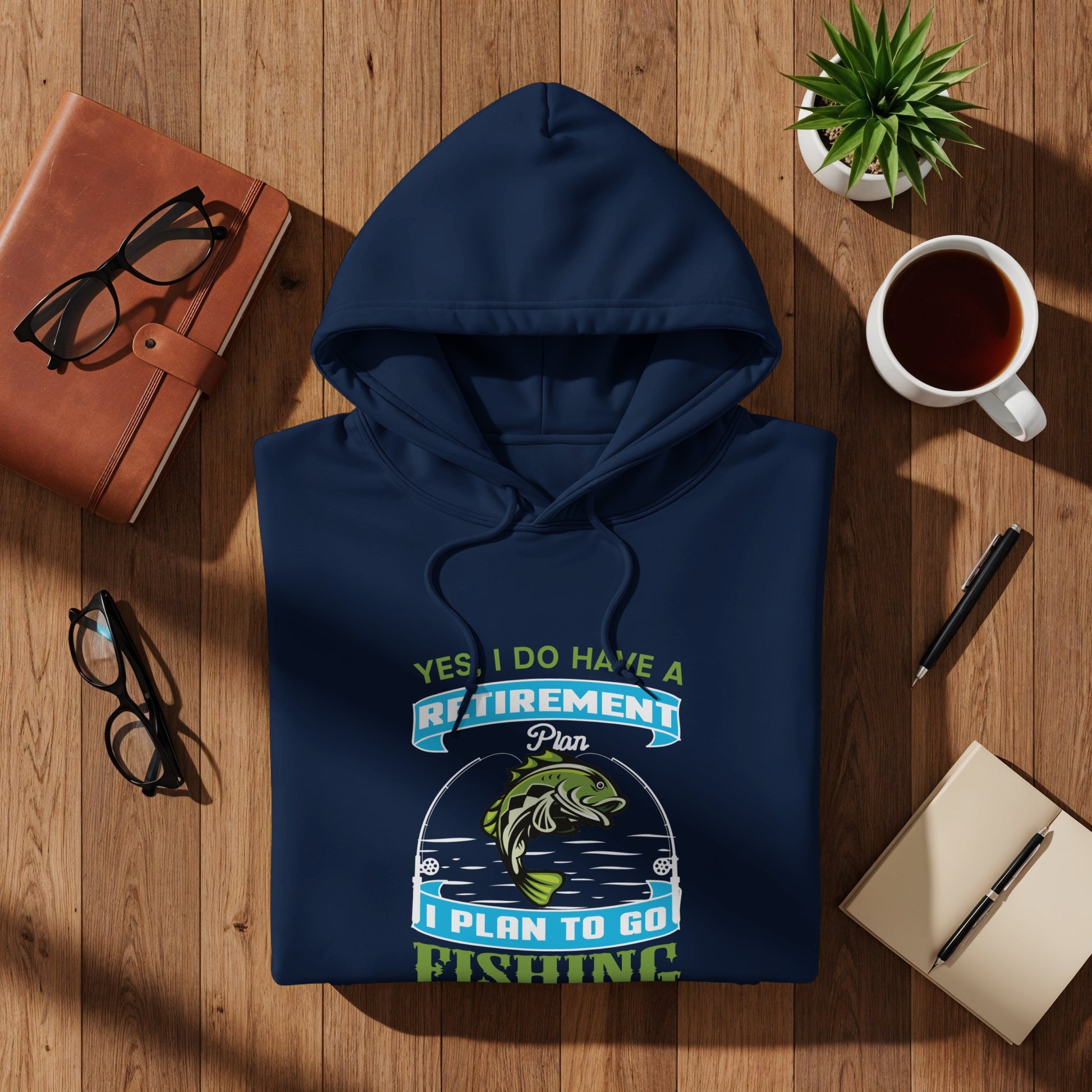 Navy hoodie with "Yes, I do have a retirement plan. I plan to go fishing" graphic.