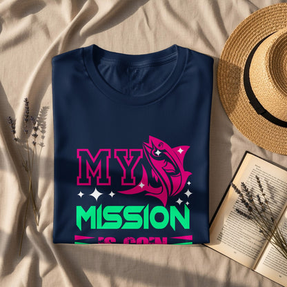 Navy t-shirt with pink fish and neon green "MY MISSION IS BORN" text.