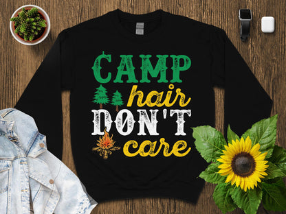 Black sweatshirt with "CAMP hair DON'T care" text, campfire, and trees graphic.