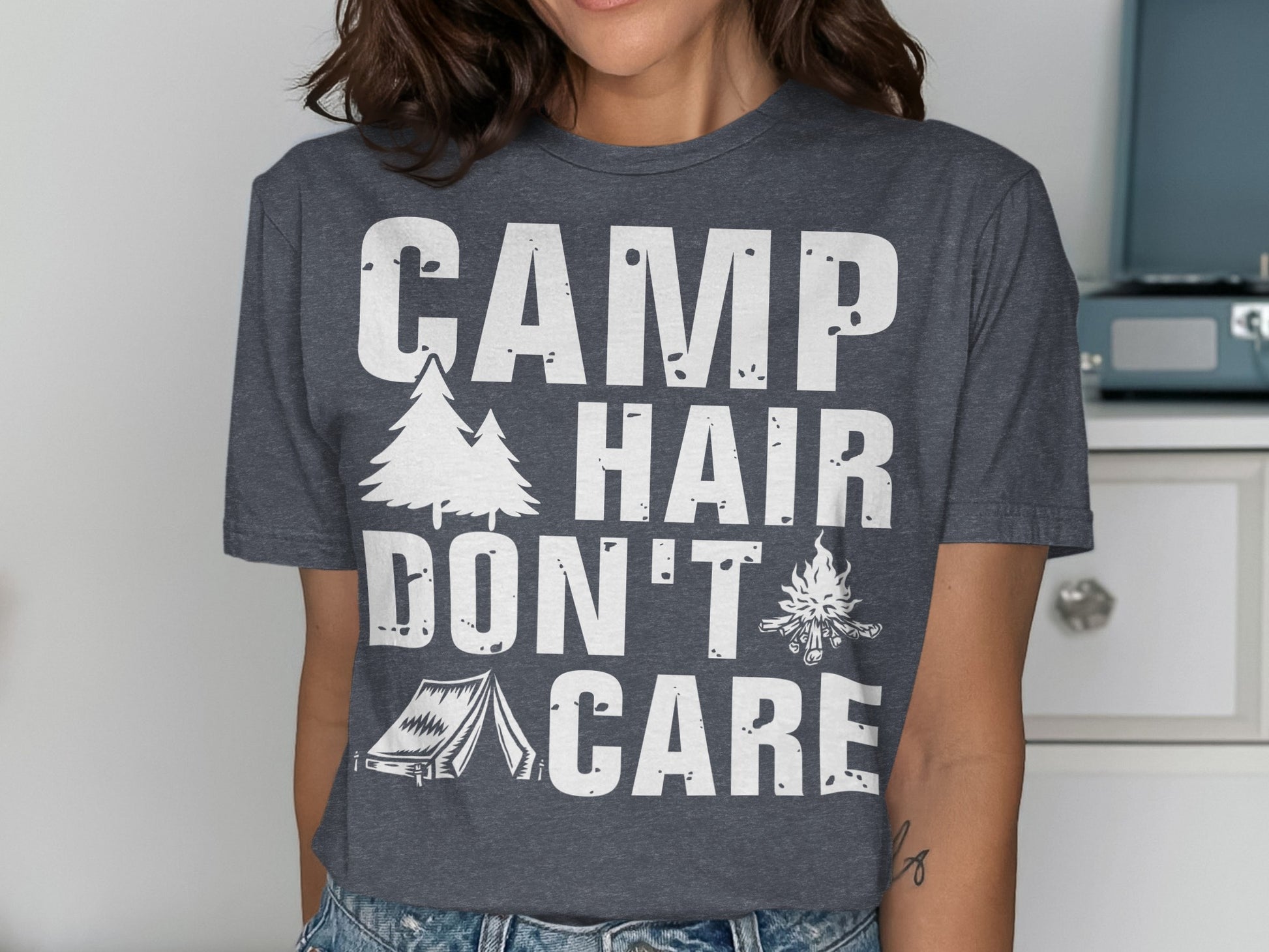 T-shirt with "CAMP HAIR DON'T CARE" text and camping graphics.