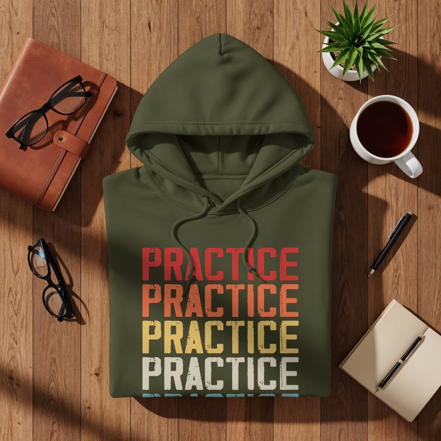 Green hoodie with "PRACTICE" repeated four times in red, orange, yellow, and green text.