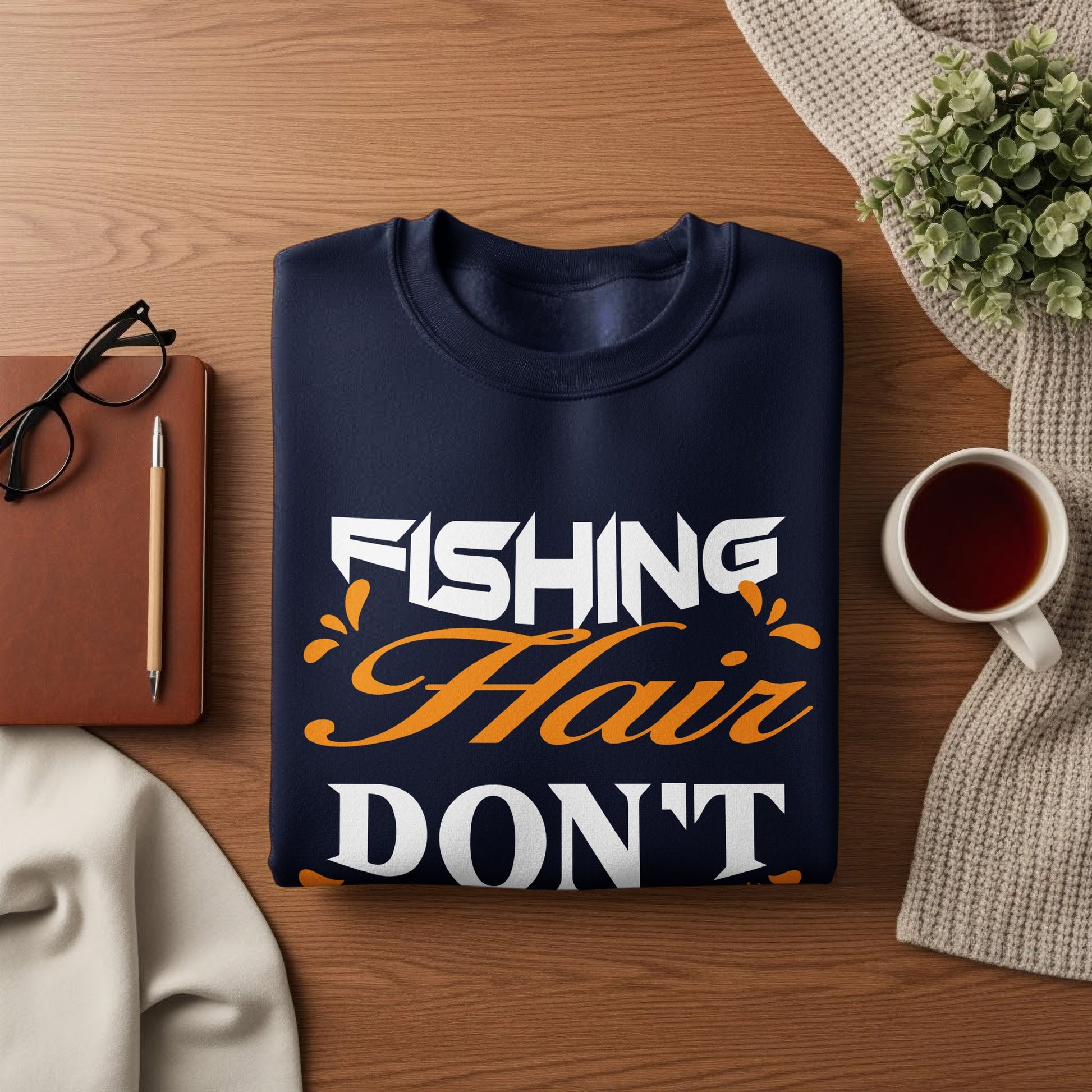 Navy sweatshirt with "FISHING HAIR DON'T CARE" text and coffee.