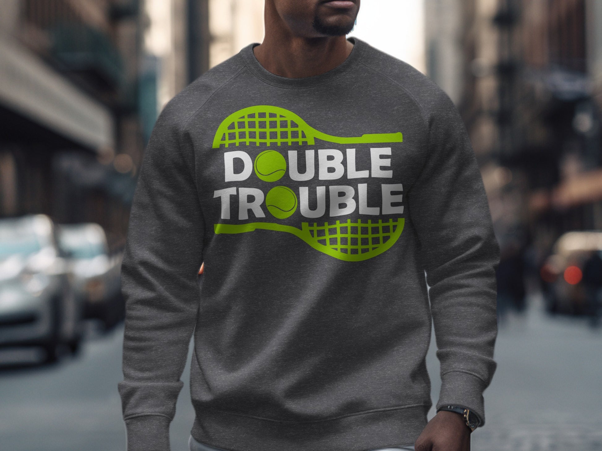Dark grey sweatshirt with "DOUBLE TROUBLE" text and tennis balls.