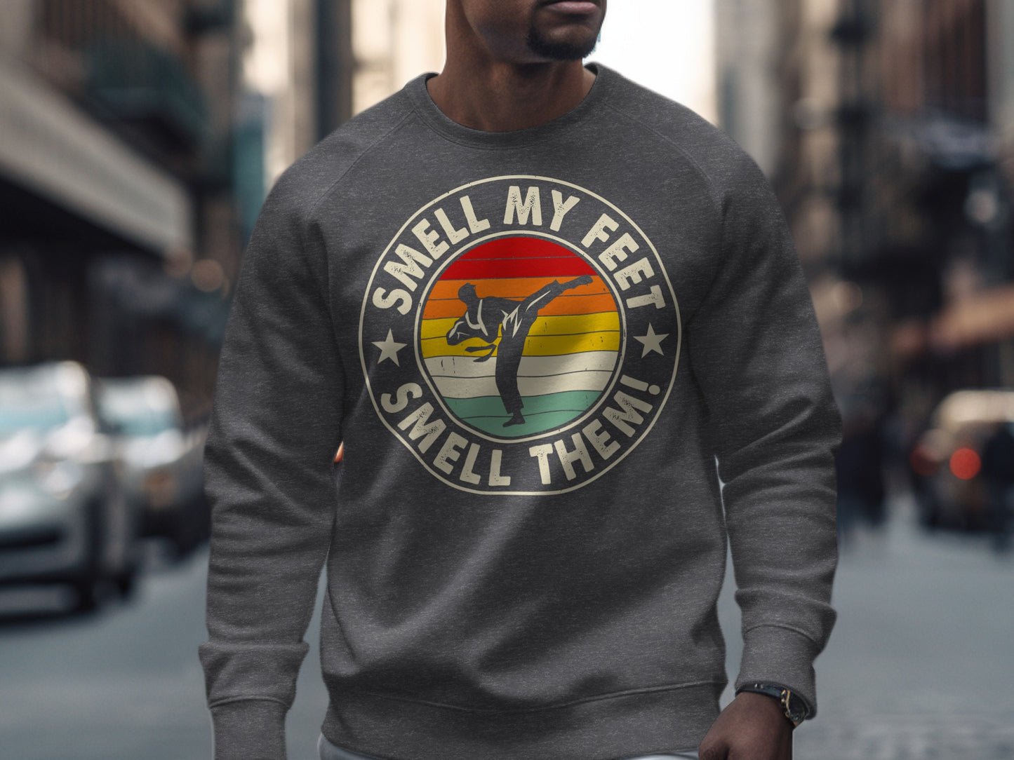 Grey sweatshirt with martial artist graphic and "Smell My Feet Smell Them!" text.