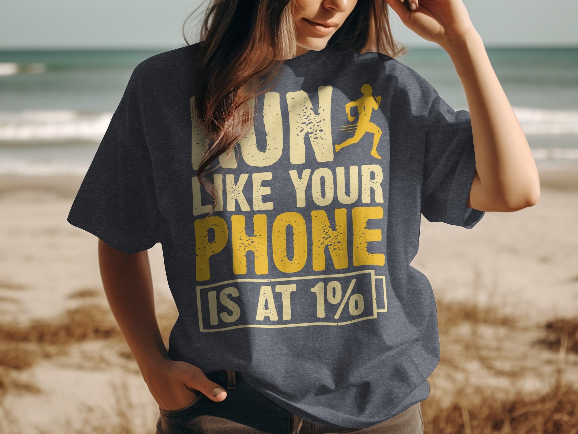 Dark t-shirt with yellow text "RUN LIKE YOUR PHONE IS AT 1%" and a running figure.