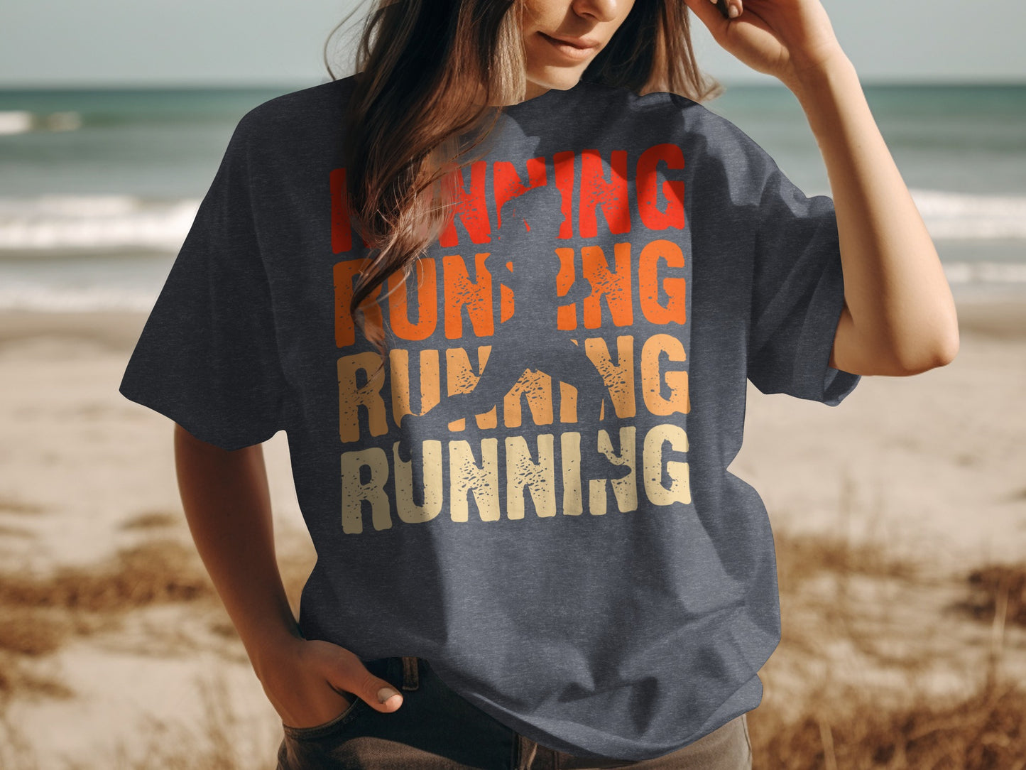 Dark t-shirt with "running" text and silhouette of runner, beach background.