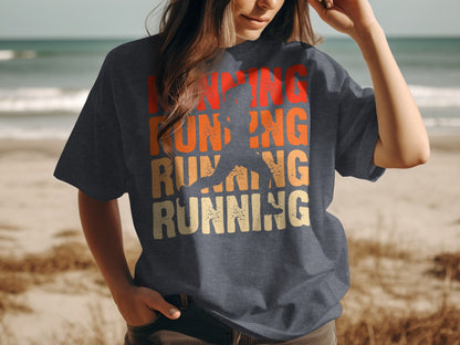 Dark t-shirt with "running" text and silhouette of runner, beach background.