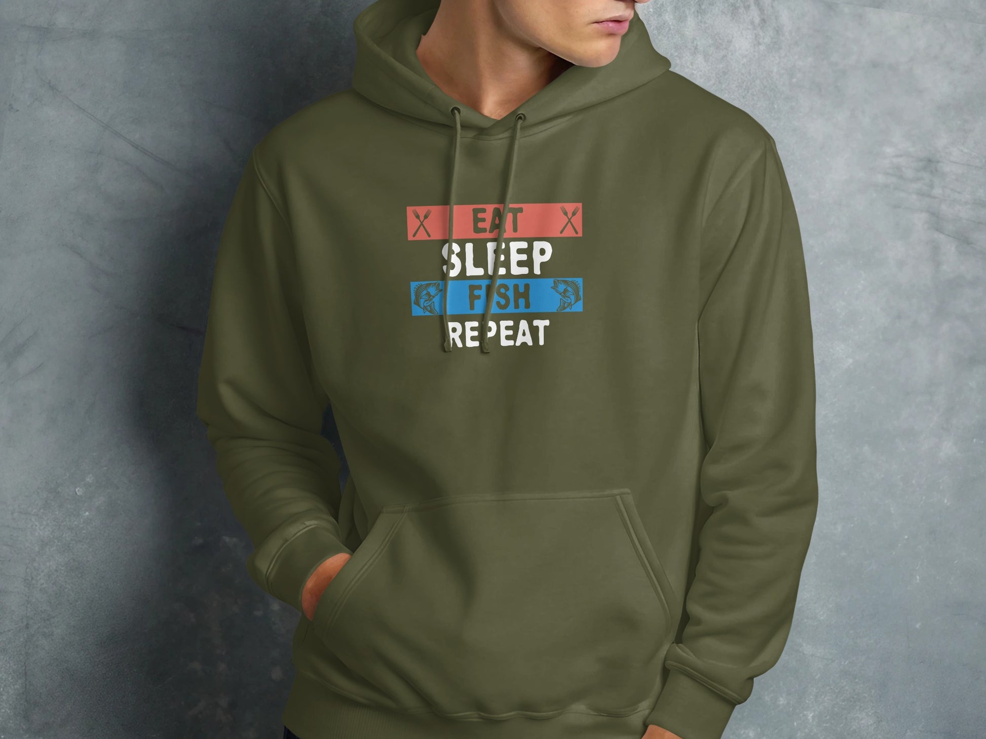 Olive green hoodie with "Eat Sleep Fish Repeat" text in red and blue.