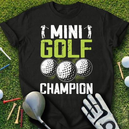 Black t-shirt with "Mini Golf Champion" text and golf ball graphics.