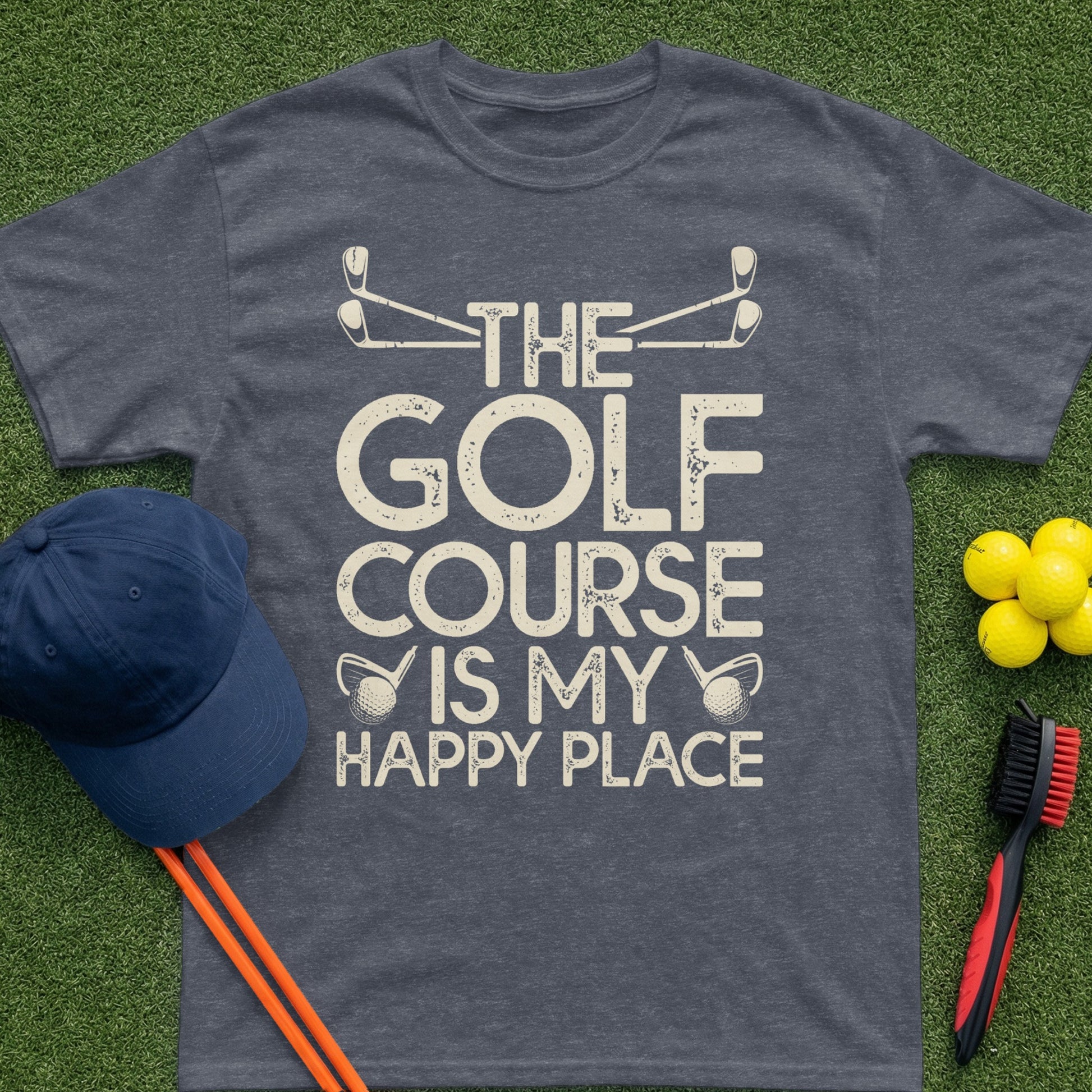 Dark heather t-shirt with "The Golf Course Is My Happy Place" text and golf club graphics.