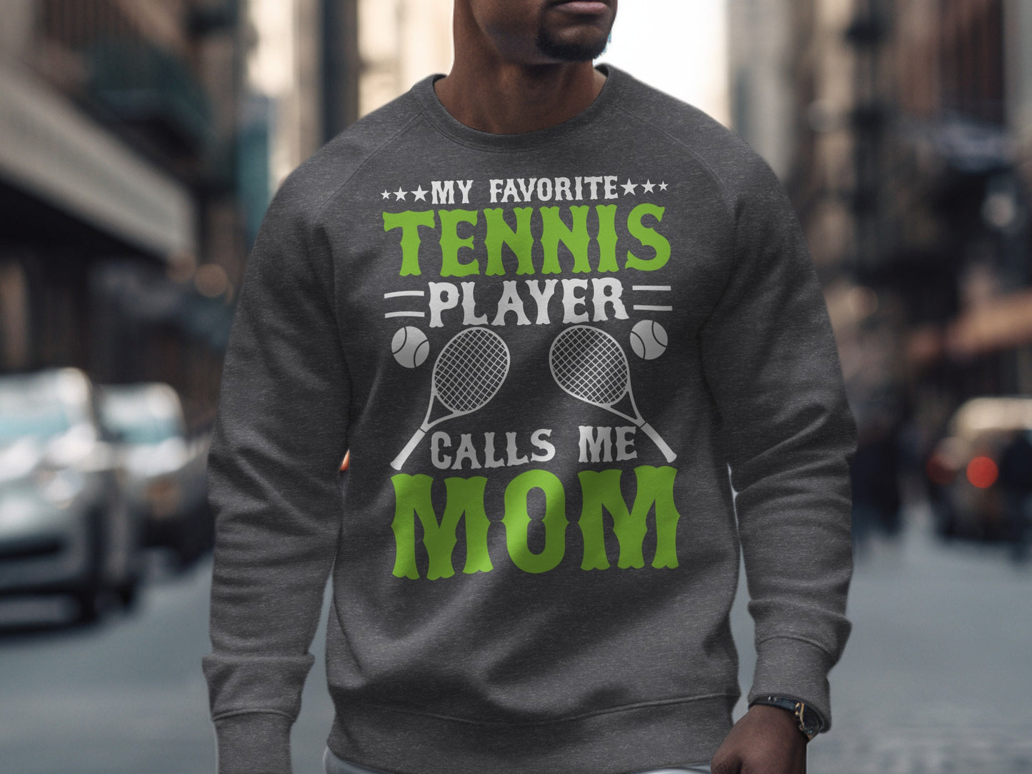 Gray sweatshirt with "My Favorite Tennis Player Calls Me Mom" and tennis rackets.