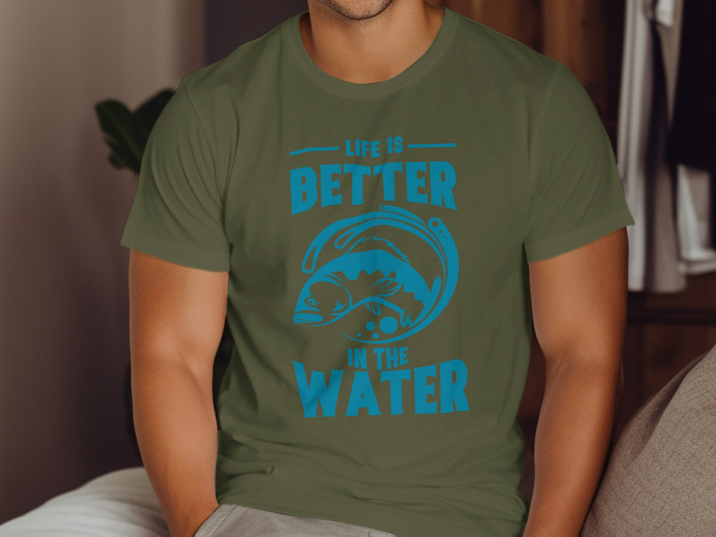 Green t-shirt with blue graphic and text "LIFE IS BETTER IN THE WATER".