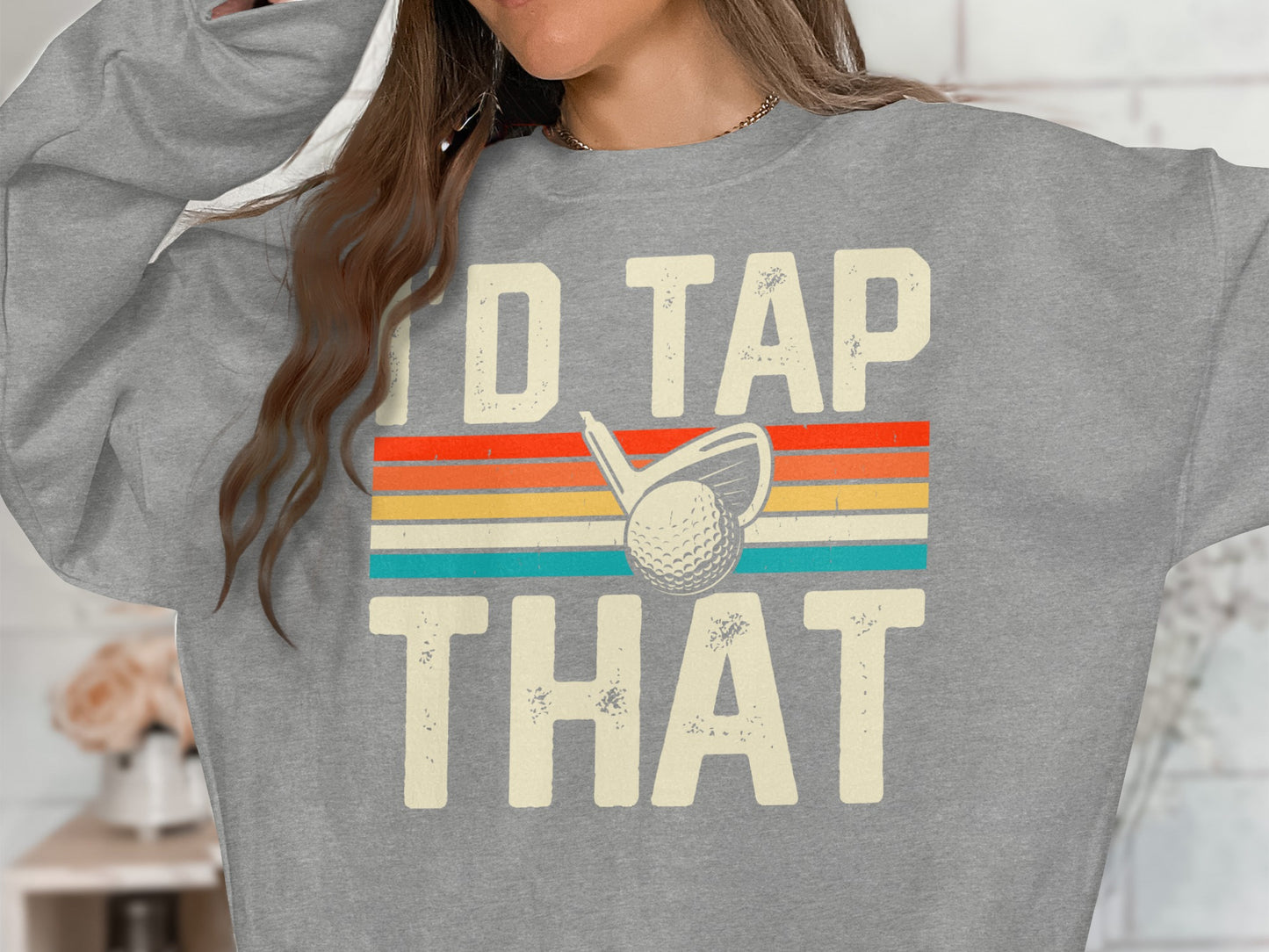 Grey sweatshirt with "I'd Tap That" and a golf ball and club graphic.
