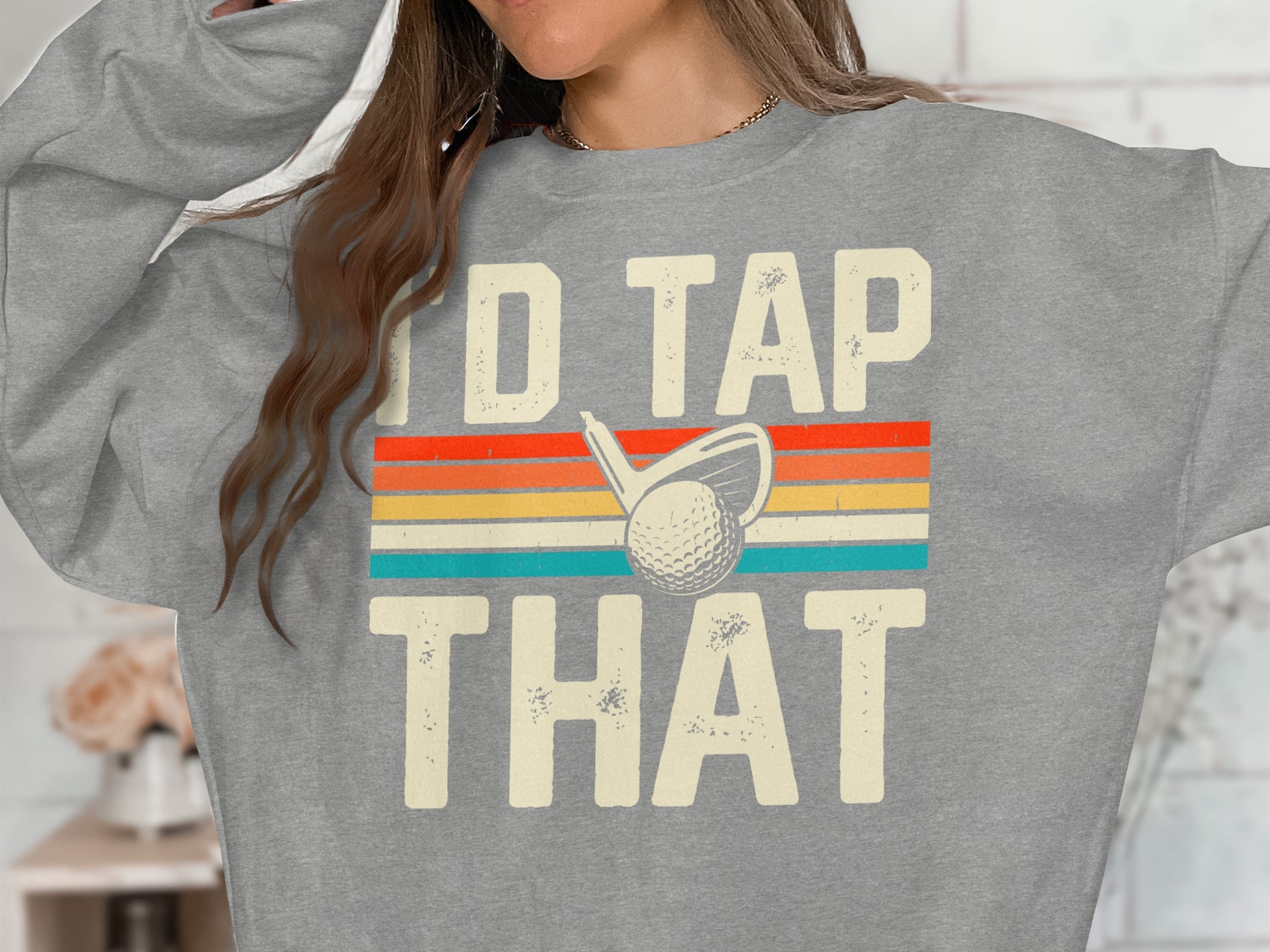 Grey sweatshirt with "I'd Tap That" and a golf ball and club graphic.