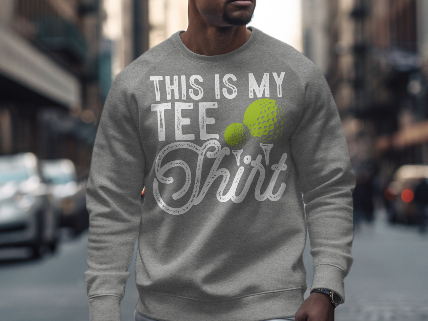 Gray sweatshirt with "This Is My Tee Shirt" and golf ball graphics.