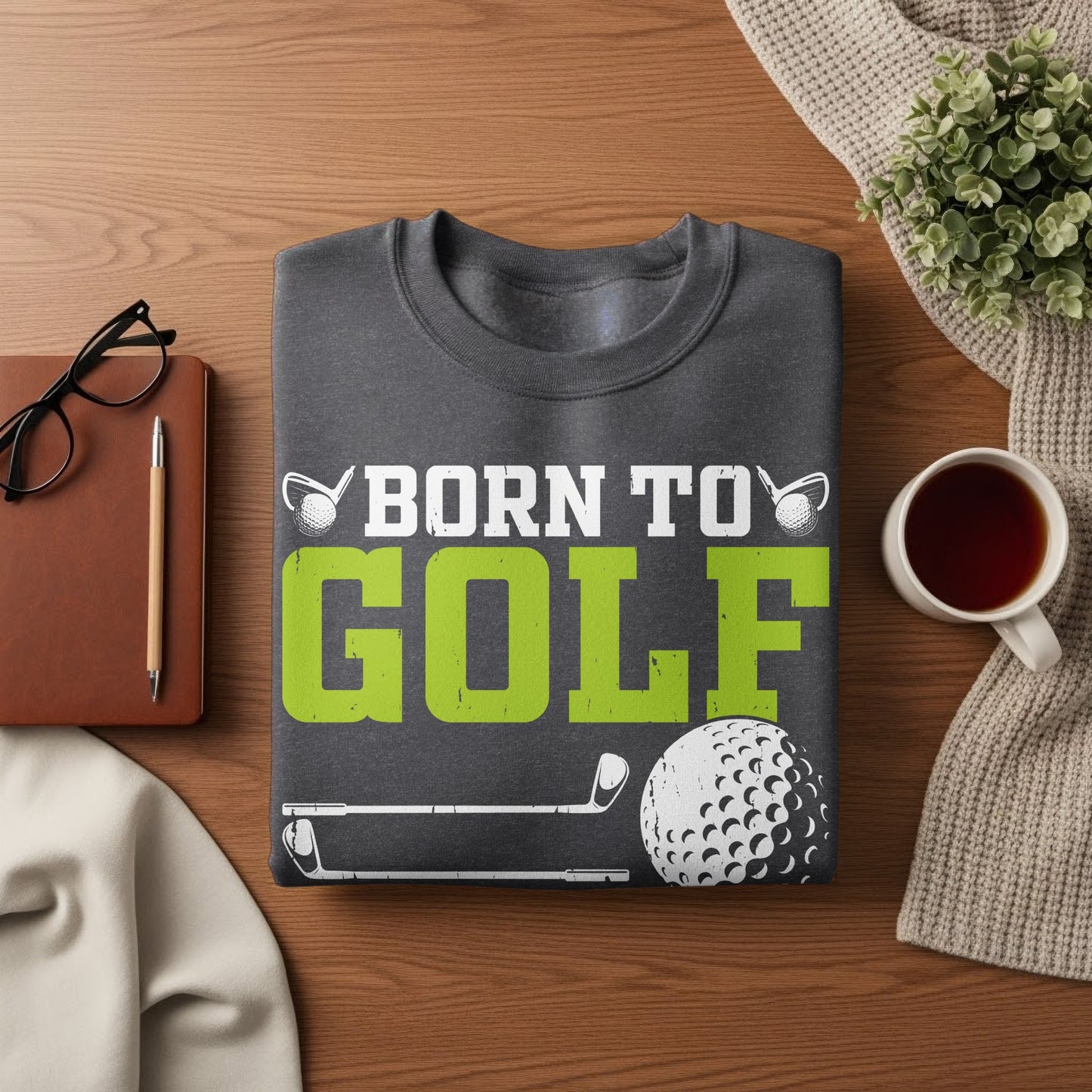 Dark gray sweatshirt with "Born to Golf" text and golf ball graphic.
