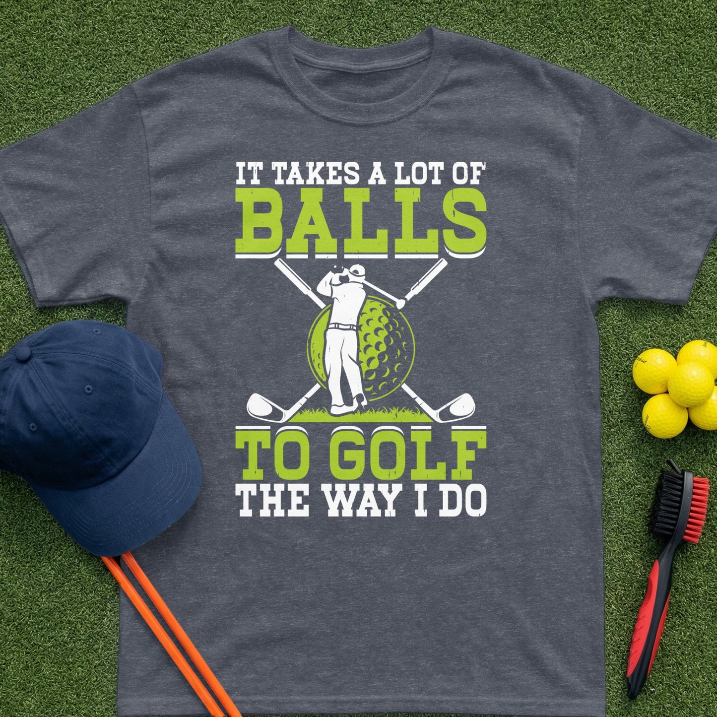 Dark t-shirt with graphic of golfer and text "It Takes a Lot of Balls To Golf The Way I Do".