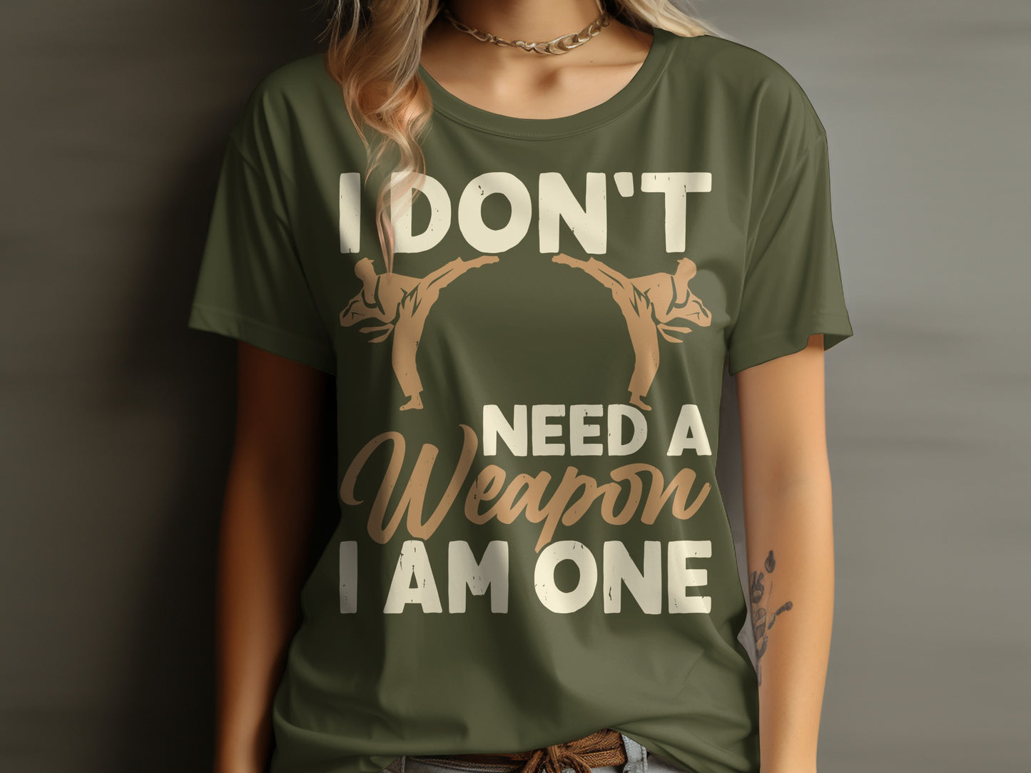 T-shirt with "I DON'T NEED A WEAPON I AM ONE" text and two martial artists.