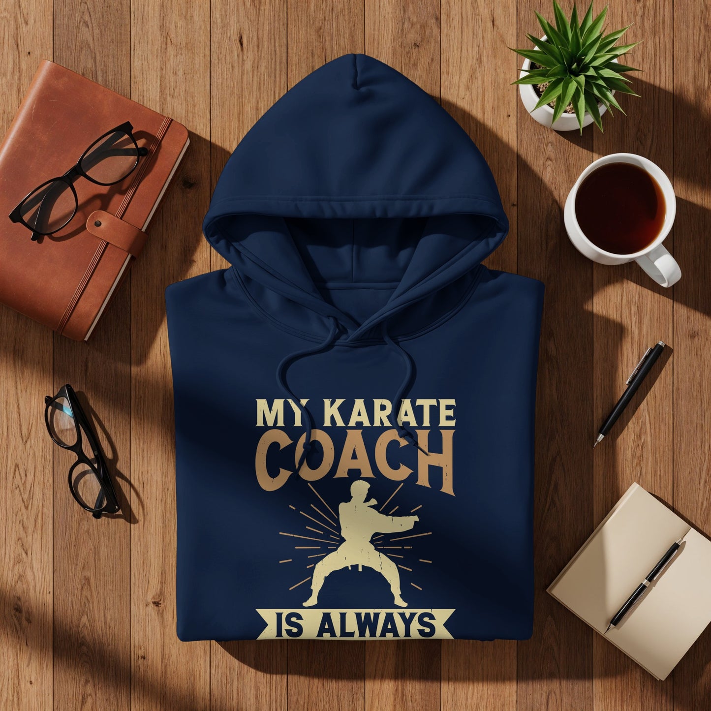Navy hoodie with "My Karate Coach Is Always" text and graphic.