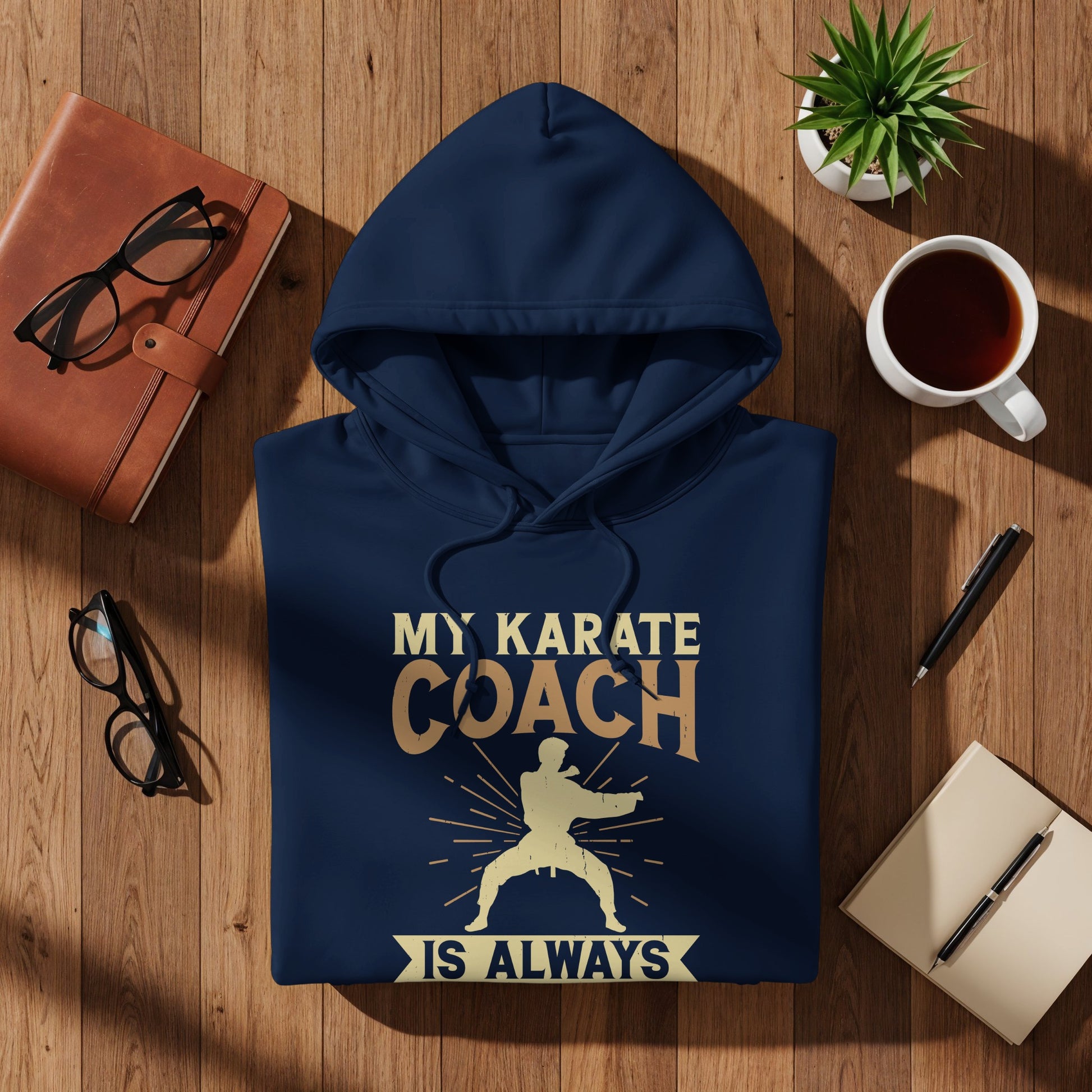 Navy hoodie with "My Karate Coach Is Always" text and graphic.