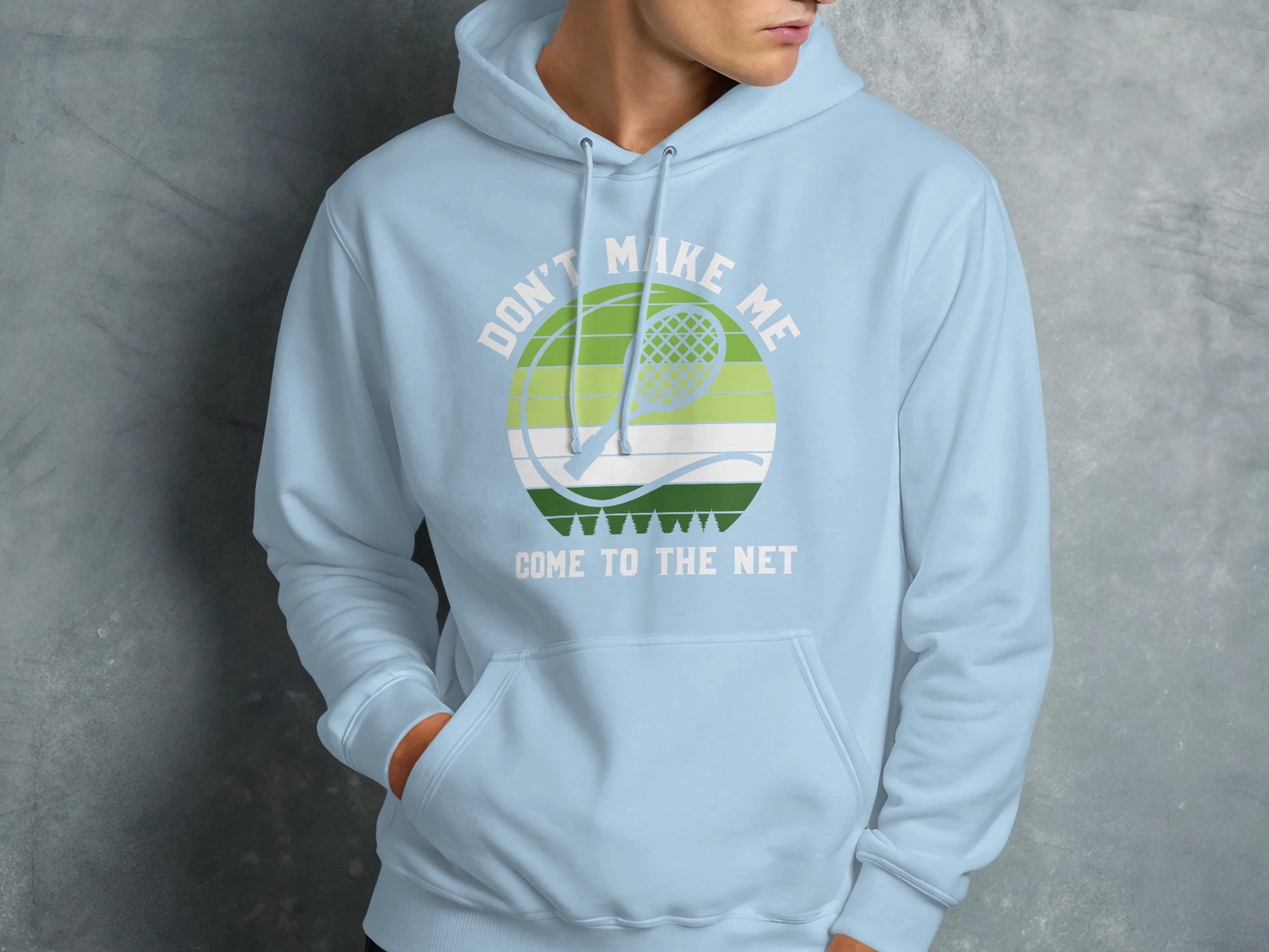 Light blue hoodie with "Don't Make Me Come to the Net" and tennis racket graphic.