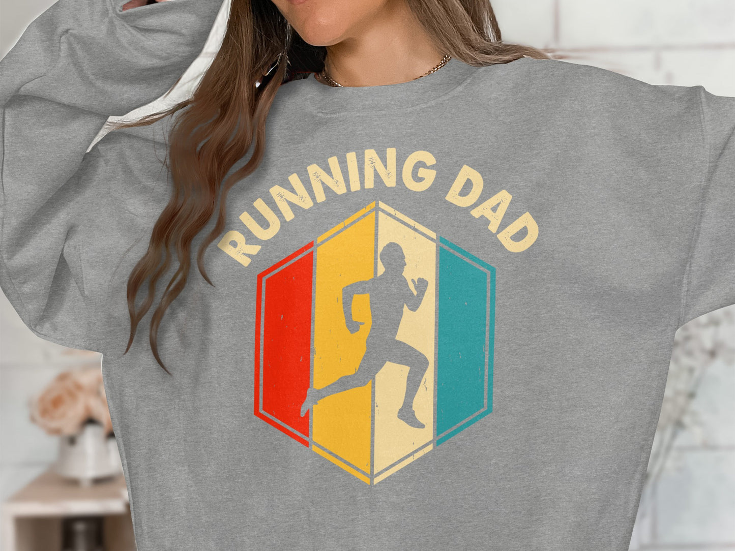 Gray sweatshirt with "Running Dad" text and geometric running man graphic.