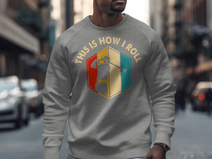 Gray sweatshirt with "This is how I roll" text and golfer graphic.