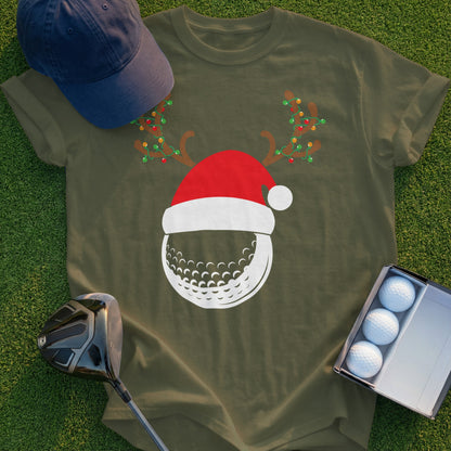 Green t-shirt with Santa hat and reindeer antlers on a golf ball.
