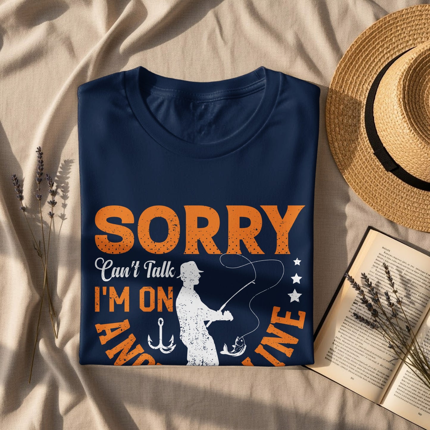 Navy t-shirt with "Sorry Can't Talk I'm On My Line" text and fishing graphic.