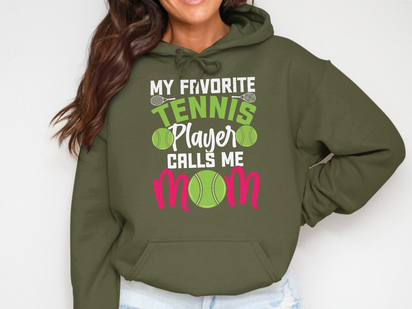 Olive green hoodie with "My Favorite Tennis Player Calls Me Mom" text and tennis graphics.