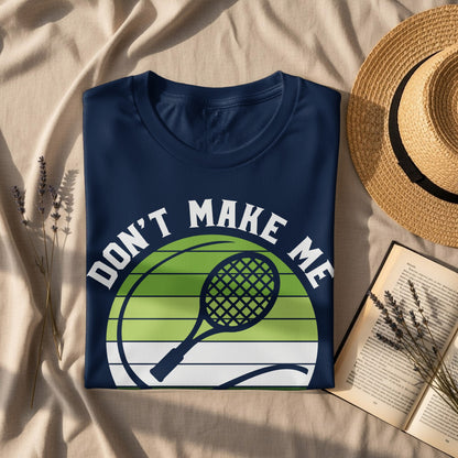 Navy t-shirt with "Don't Make Me" text and tennis racket design.