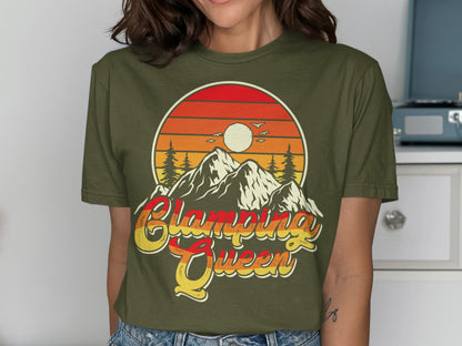 Olive green t-shirt with "Glamping Queen" text and mountain sunset graphic.