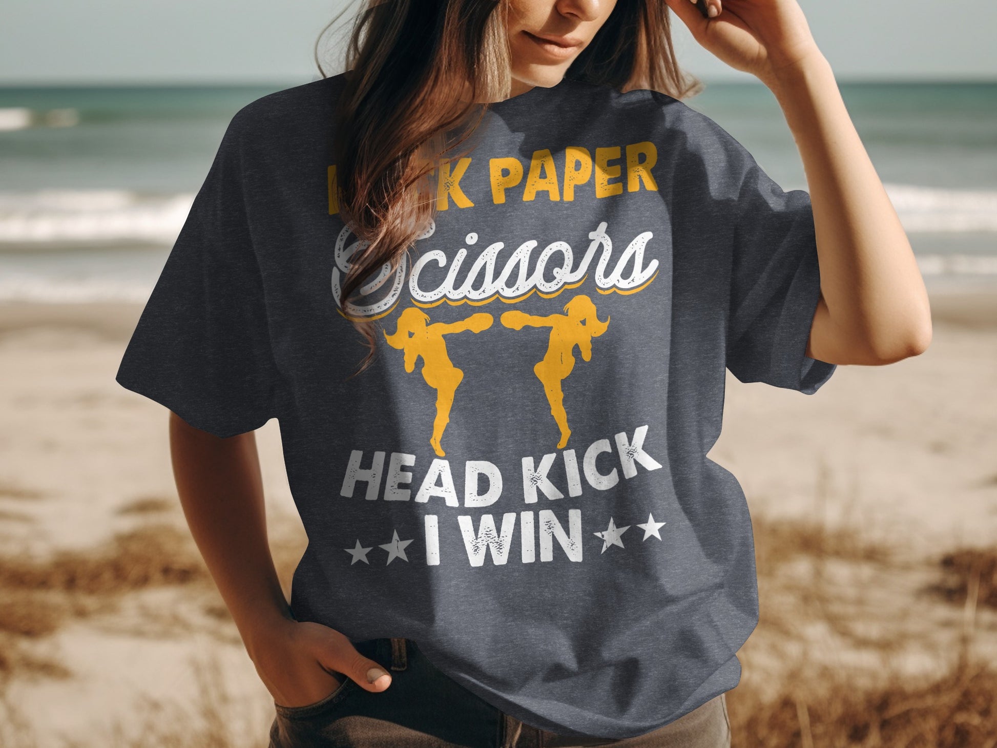 Dark grey t-shirt with "Rock Paper Scissors Head Kick I Win" text and graphic.