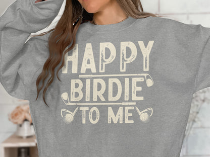 Grey sweatshirt with "Happy Birdie To Me" text and golf club graphics.
