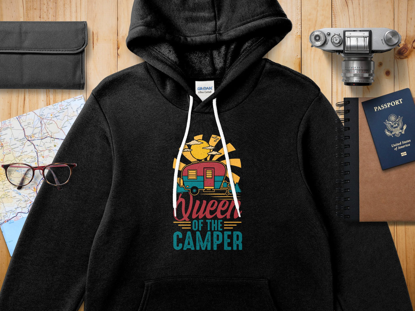 Black Gildan hoodie with "Queen of the Camper" graphic featuring a colorful vintage camper.