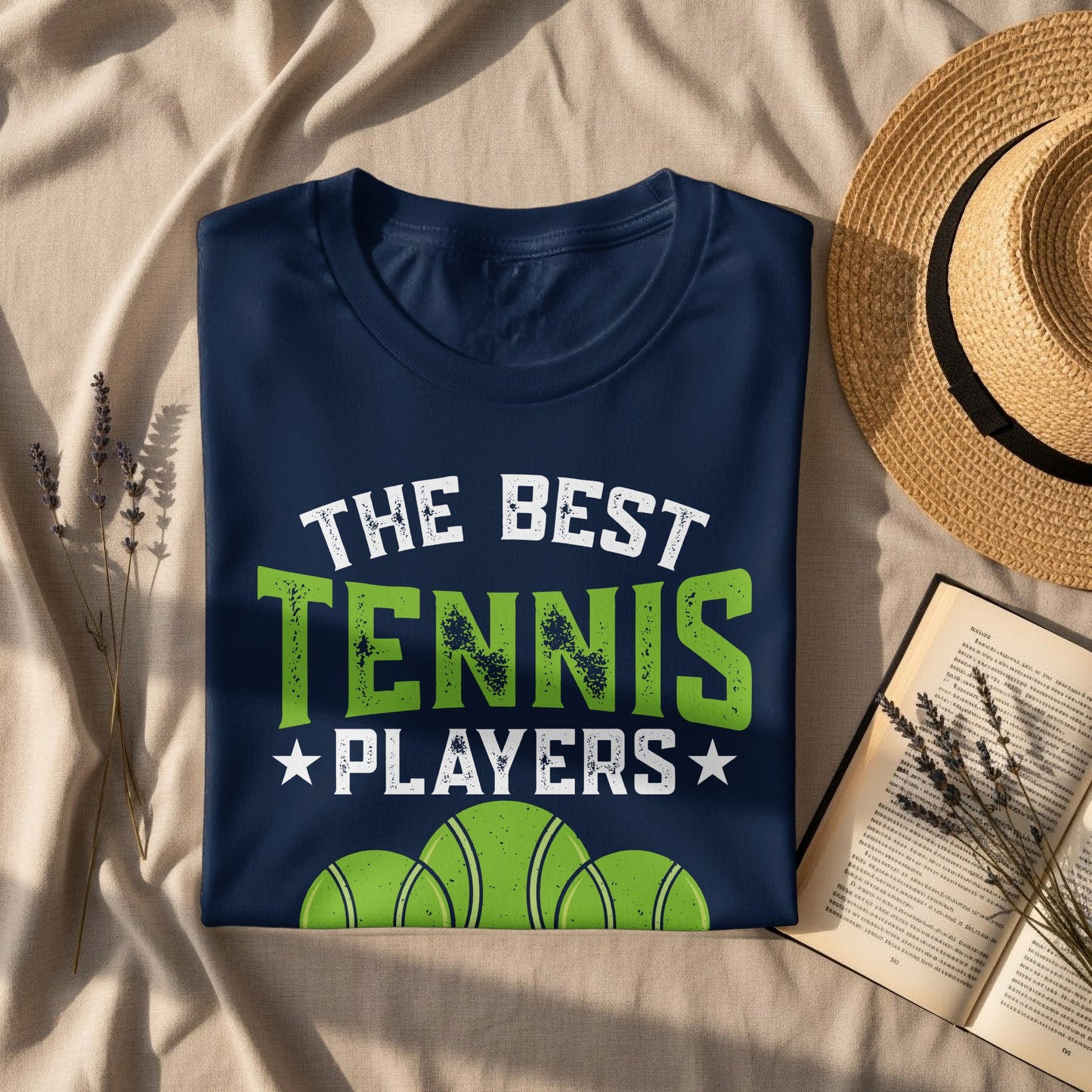 Navy t-shirt with "The Best Tennis Players" and tennis balls graphic.