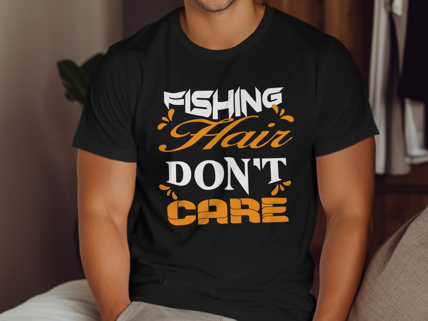 Black t-shirt with "FISHING HAIR DON'T CARE" text in white and orange.