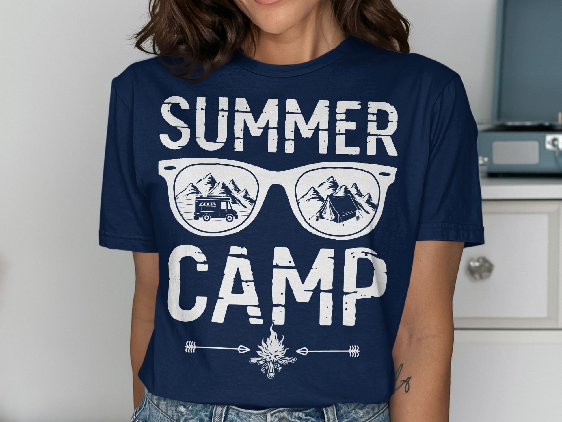 Navy t-shirt with "SUMMER CAMP" text and sunglasses reflecting a camping scene.