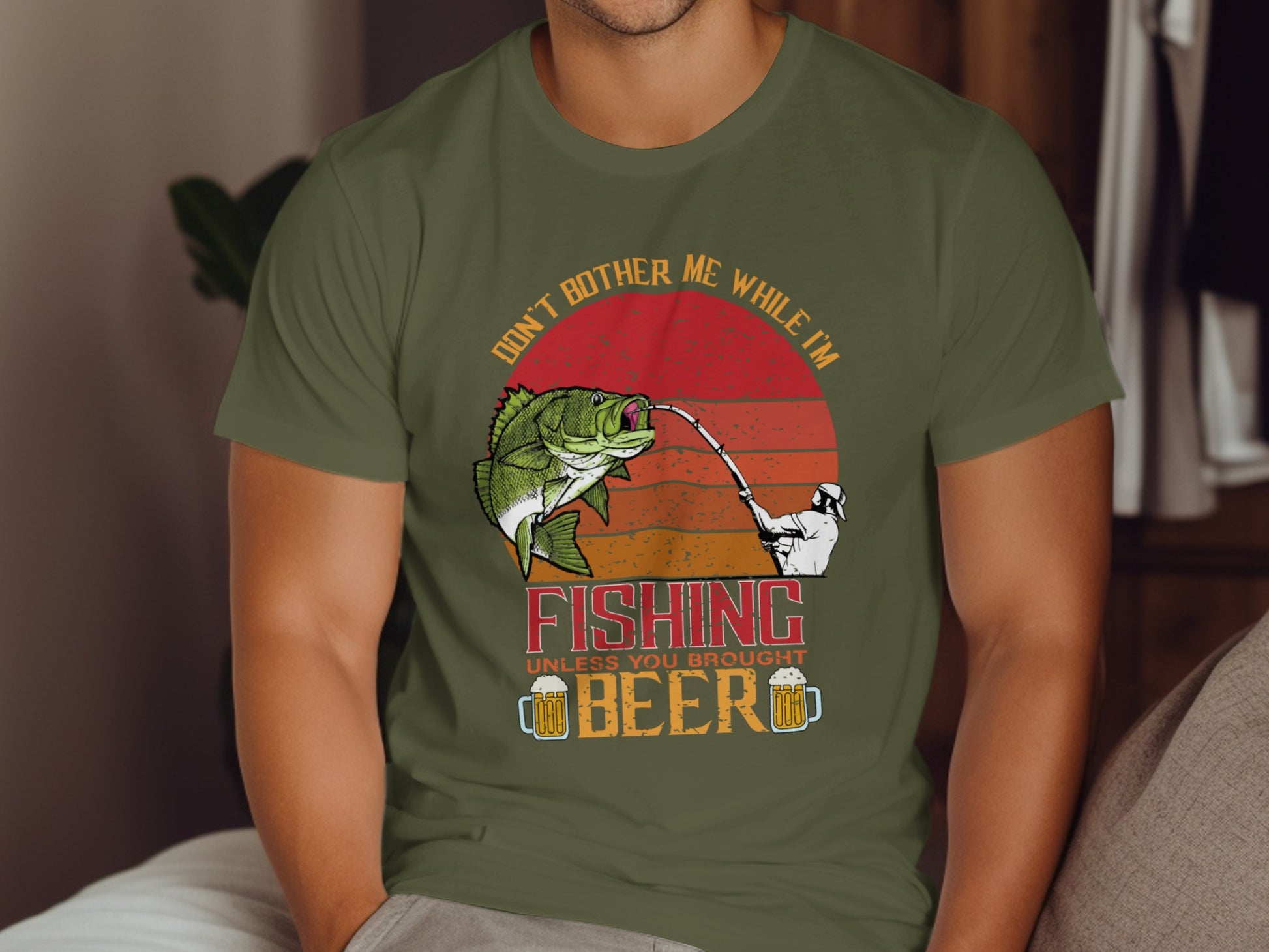 Green t-shirt with "Don't bother me while I'm fishing unless you brought beer" text and graphic.
