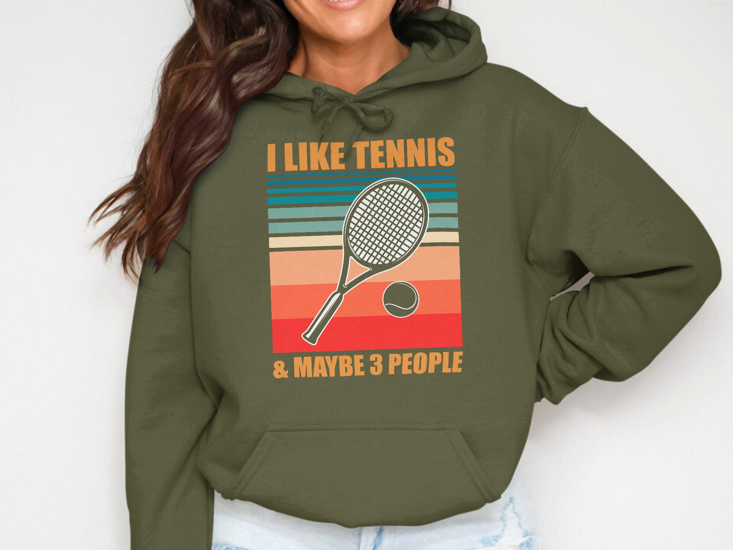 Olive green hoodie with "I like tennis & maybe 3 people" text and tennis racket graphic.
