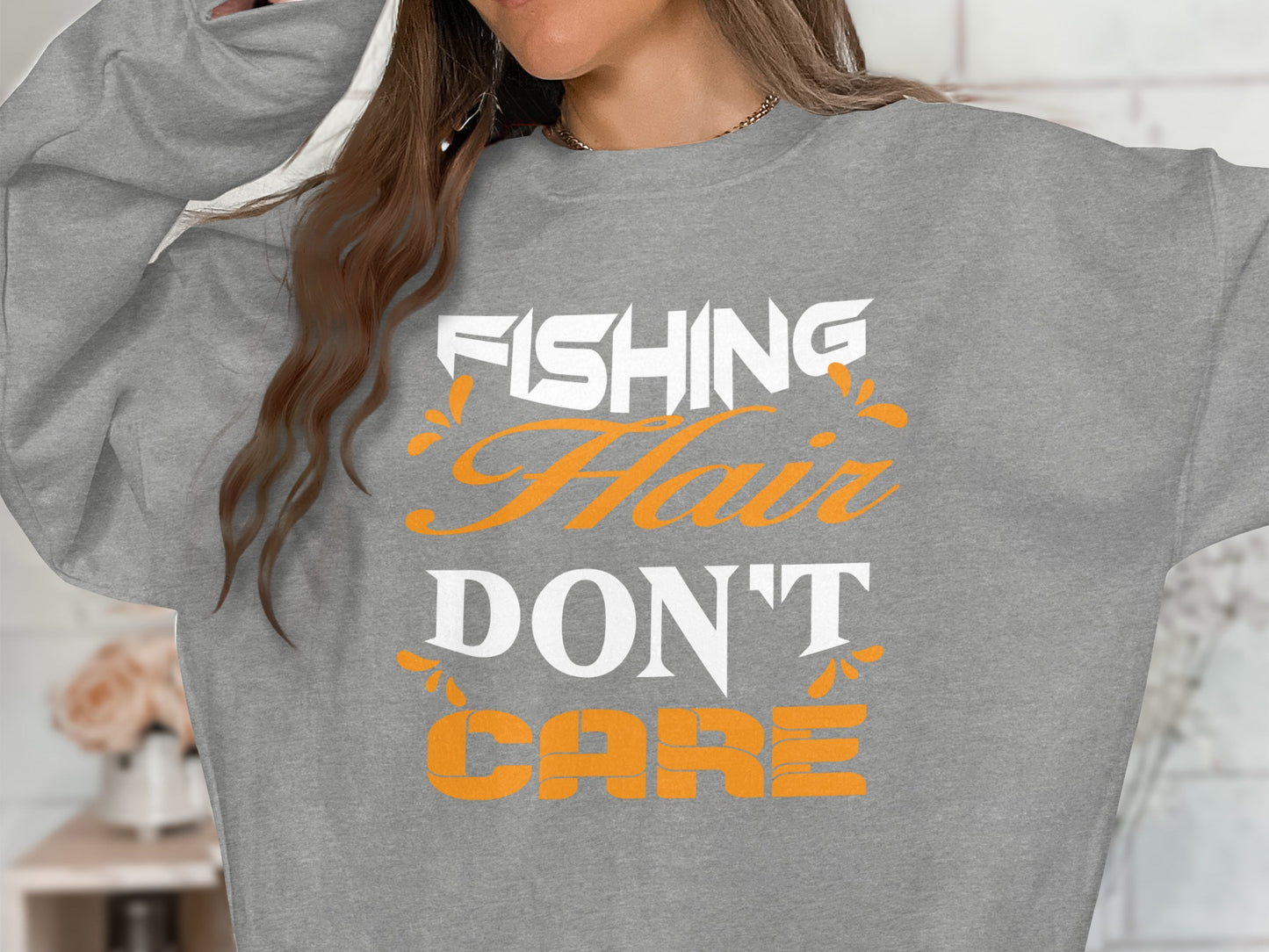 Grey sweatshirt with "Fishing Hair Don't Care" text.