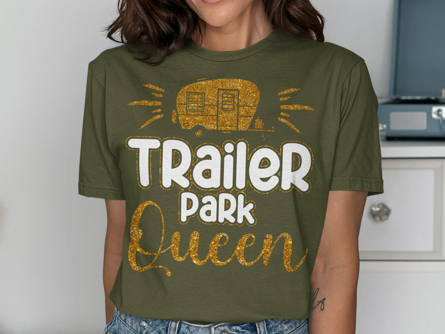 Green t-shirt with "Trailer Park Queen" text and glittery camper graphic.