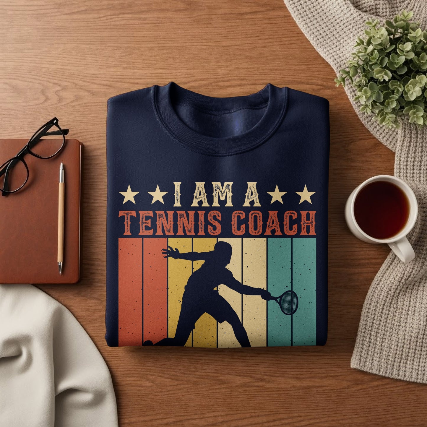 Navy sweatshirt with "I Am A Tennis Coach" text and silhouette of a tennis player.