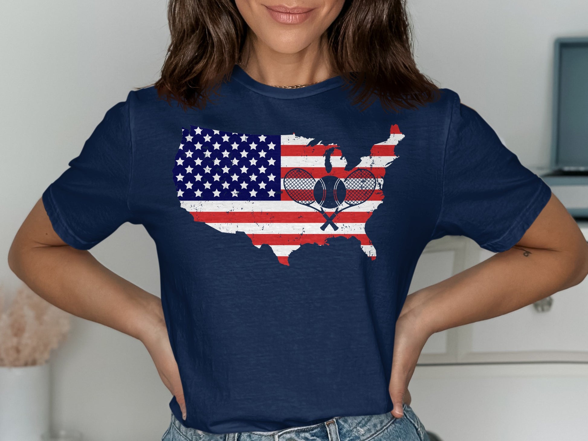 Navy t-shirt with American flag map and crossed tennis rackets.